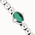 Beaded bracelet with oval faceted green crystal